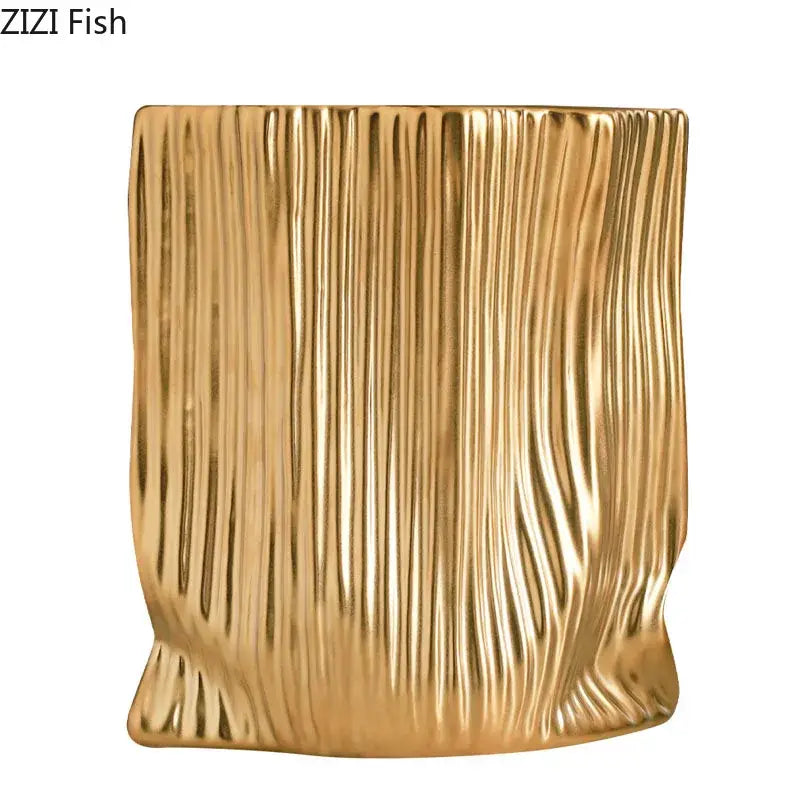 Modern black and gold ceramic bag vase with a gold-colored vertically ribbed ceramic planter for living room decorbites ceramic decor
