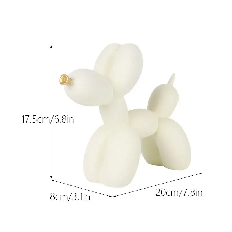 A sleek off-white balloon dog candle with golden nose and glossy finish for modern black and gold crackle living room decor