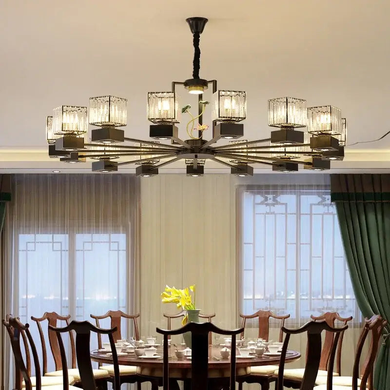 Modern black and gold dining room chandelier with crystal glass shades and floral vine design for decorbites crystal dining