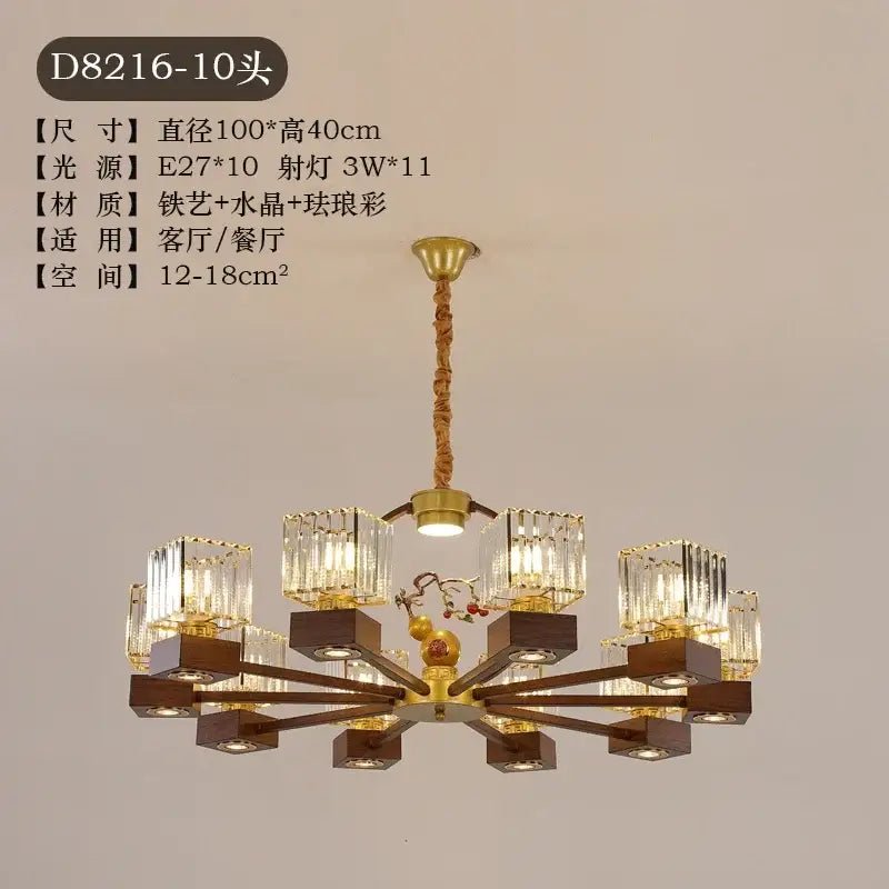 Modern black and gold crystal dining room chandelier with ten crystal-encased lights and dark wood arms decorbites crystal dining