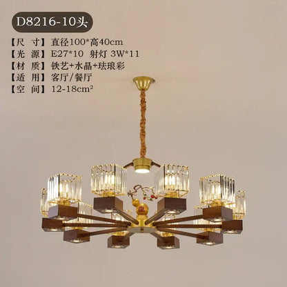 Modern black and gold crystal dining room chandelier with ten crystal-encased lights and dark wood arms decorbites crystal dining