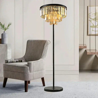 Modern black and gold crystal floor lamp with metal frame and cascading golden prisms for living room decor