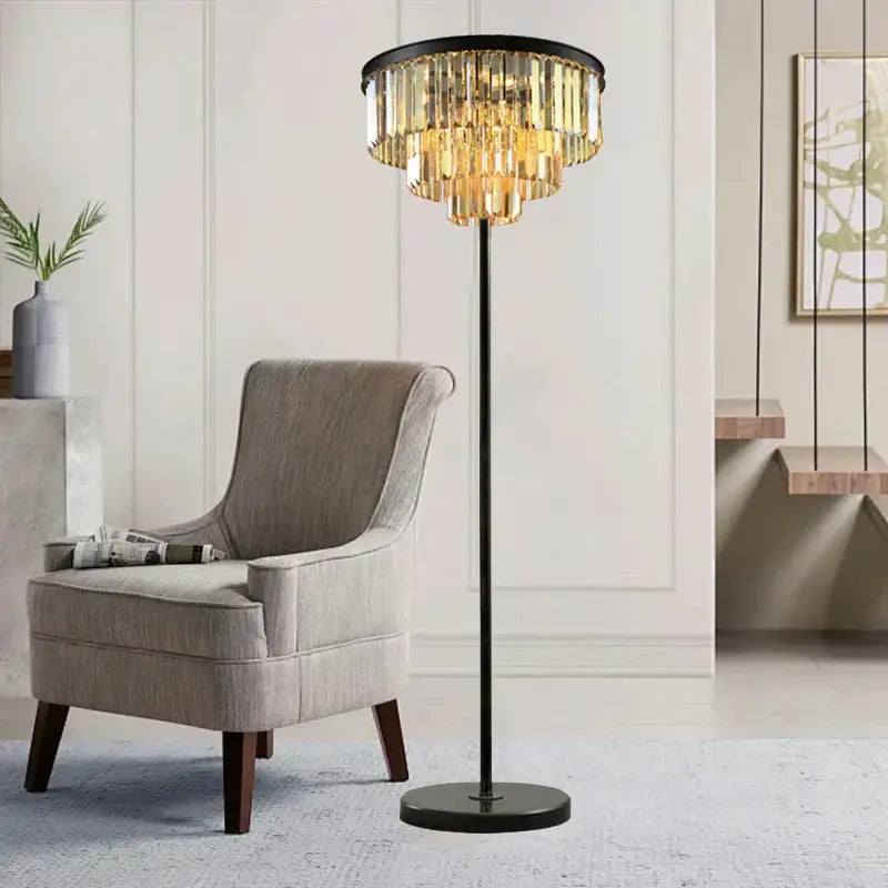 Modern black and gold crystal floor lamp with metal frame and cascading golden prisms for living room decor