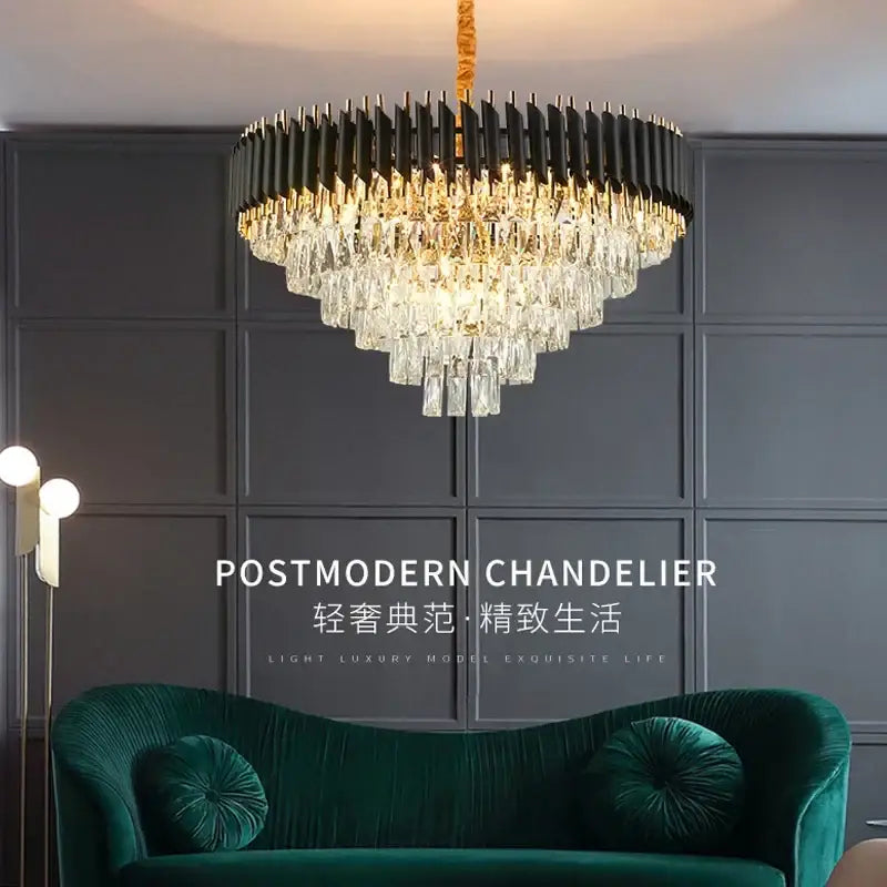 A modern black and gold decorbites crystal pendant chandelier with ribbed frame and clear crystal prisms for dining room light