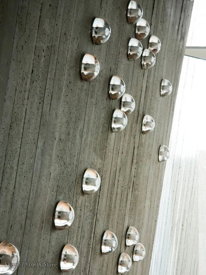 Modern black and gold crystal wall light with silver semi-spherical metallic decorbites crystal wall pieces on concrete