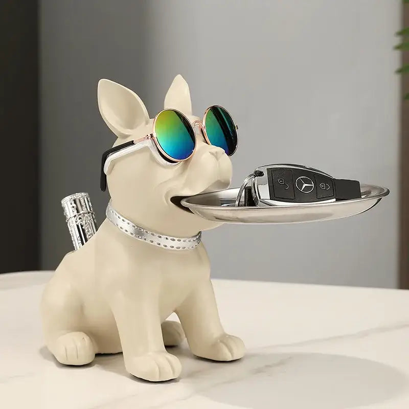 Cream-colored resin decorbites bulldog statue with silver collar and tray holding car keys for living room decor