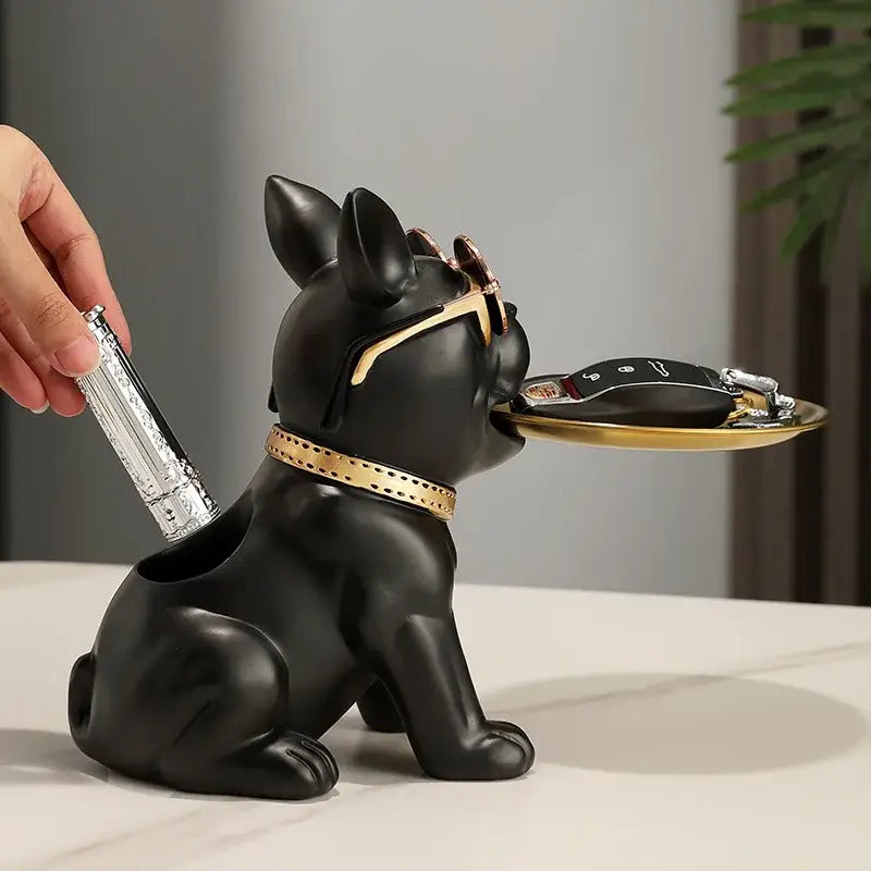 Modern black and gold decorbites bulldog statue key holder with gold-trimmed collar holding a golden tray for keys