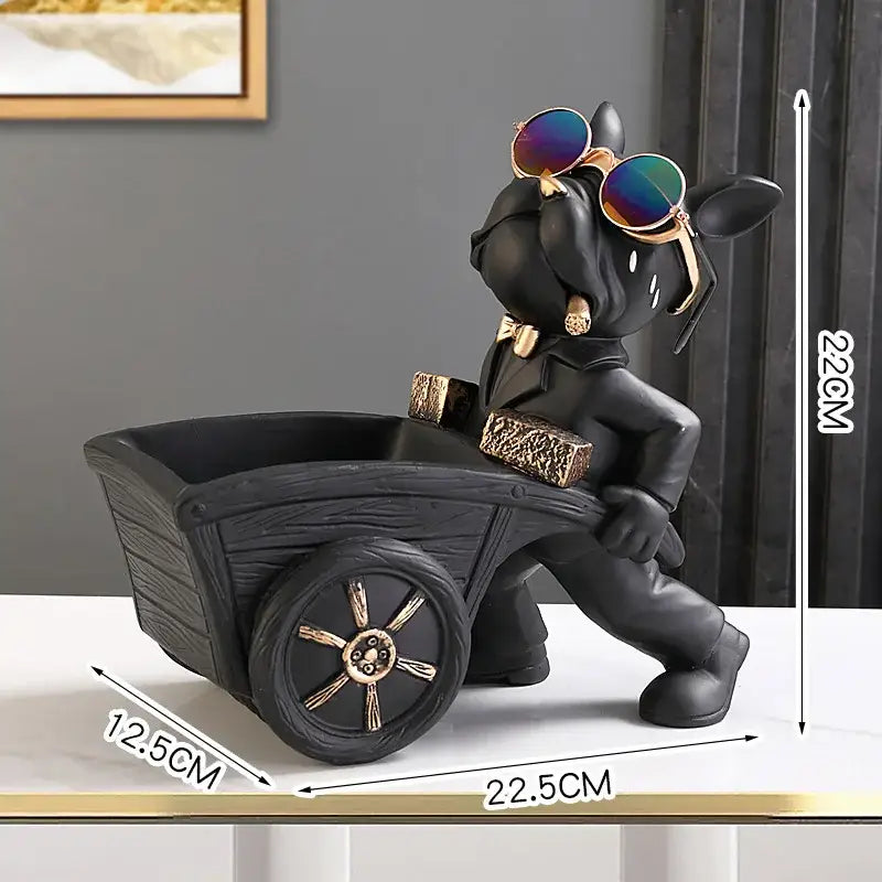 Modern black and gold decorbites dog statue resin art featuring a stylized dog with sunglasses pushing a miniature cart