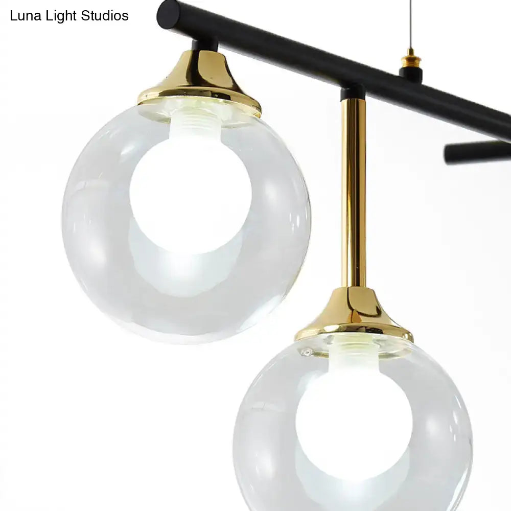 DecorBites™ modern black glass ball island chandelier with clear glass globes and brass fixtures for dining room lighting