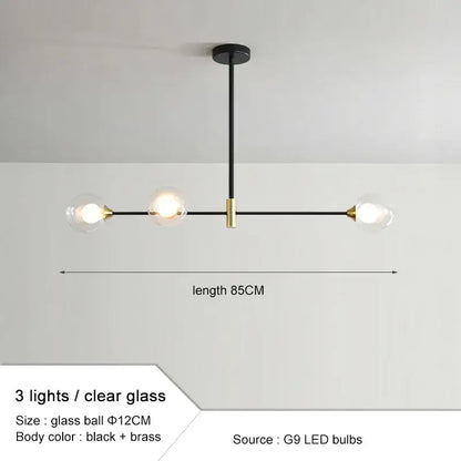 Modern black and brass glass ball pendant chandelier with three clear globes for dining room decorbites glass ball design