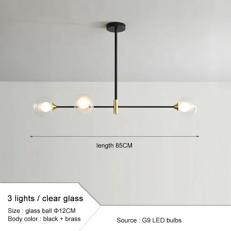 Modern black and brass glass ball pendant chandelier with three clear globes for dining room decorbites glass ball design