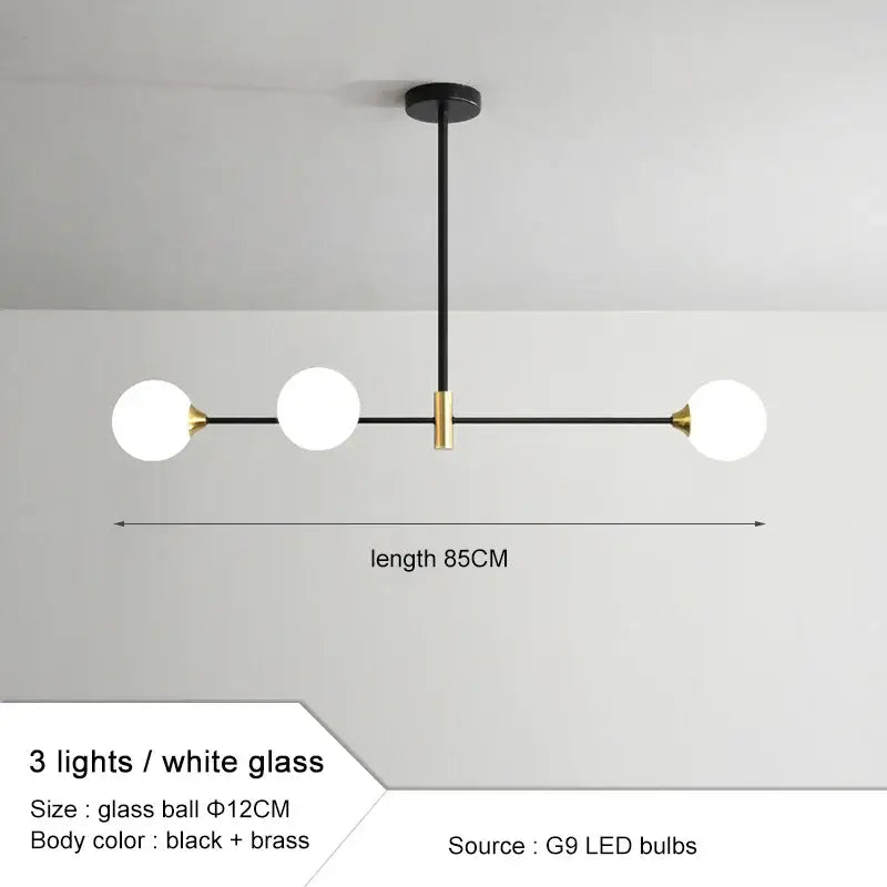 Modern black and brass glass ball pendant chandelier with three white glass globe bulbs for dining room decorbites glass ball