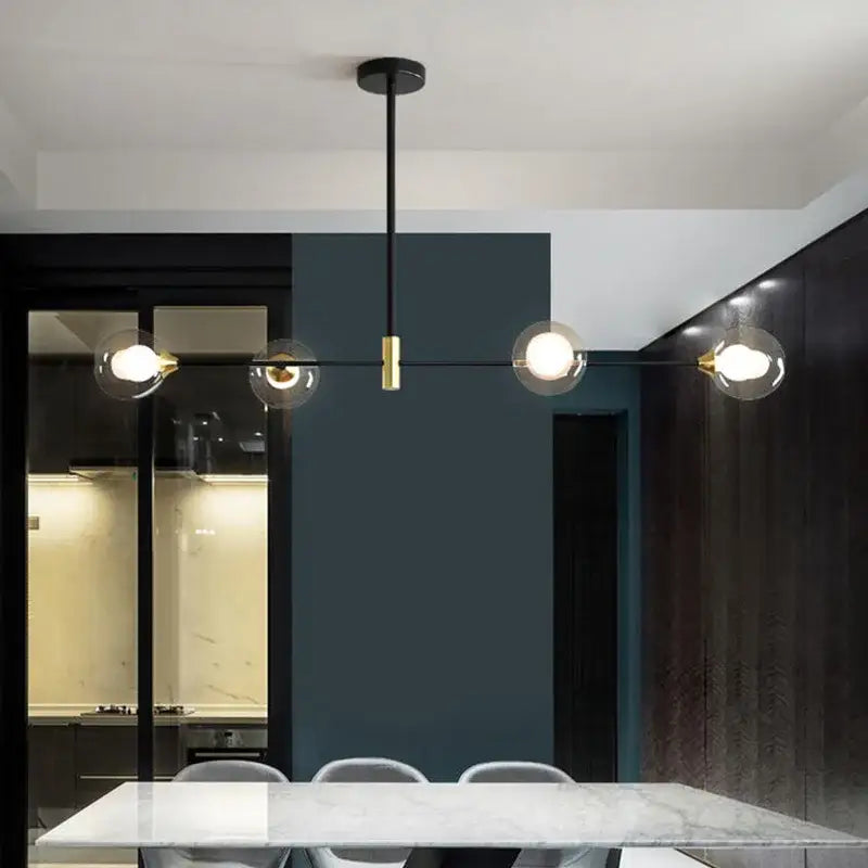 Modern black and brass decorbites glass ball pendant chandelier with clear glass globe bulbs for dining room decor