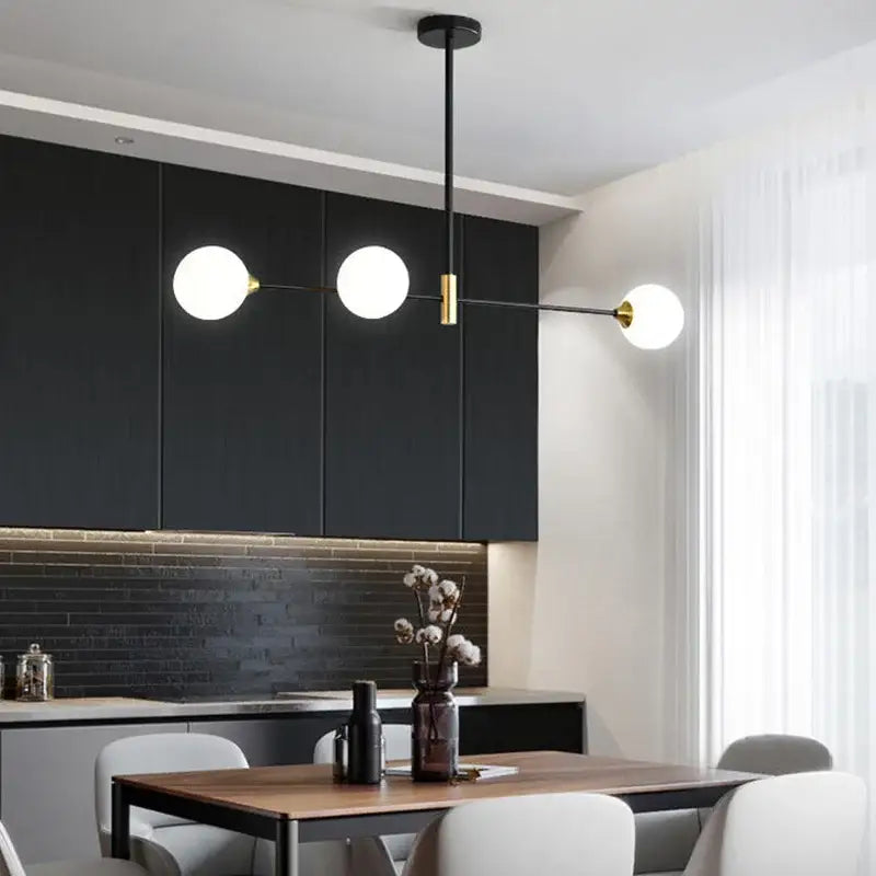 Modern black and brass glass ball pendant chandelier with three white globe bulbs for dining room decorbites glass ball