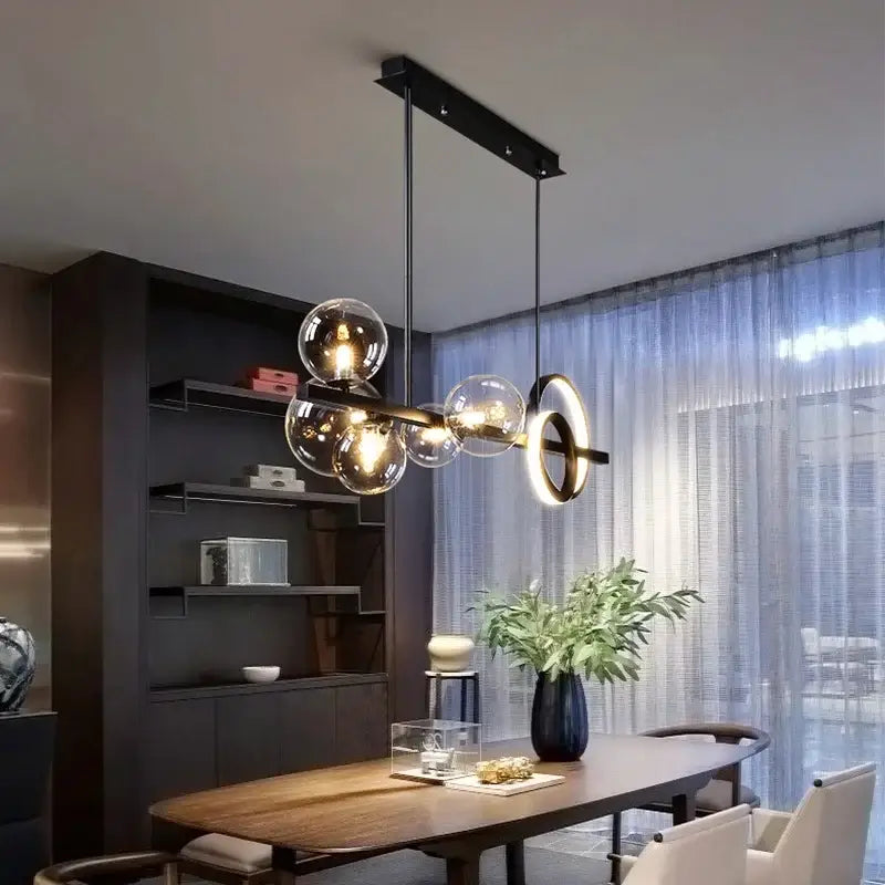 Modern black and gold glass ball pendant chandelier featuring a glass ball pendant light with black metal frame decorbites glass ball