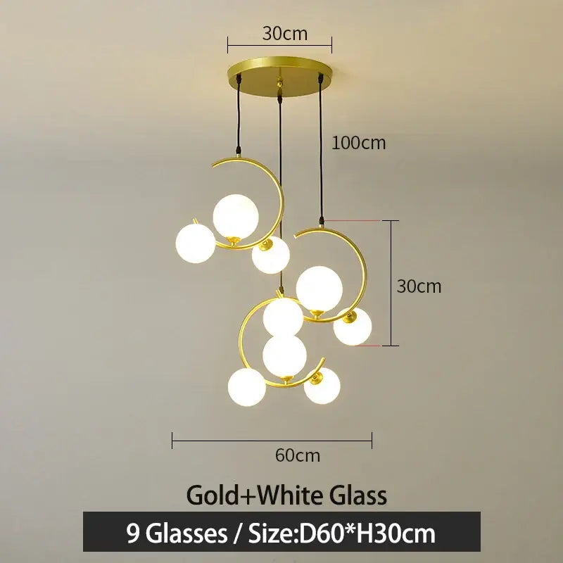 Modern black and gold glass ball pendant light with nine white glass globes and curved metallic rings for living room decorbites glass ball pendant