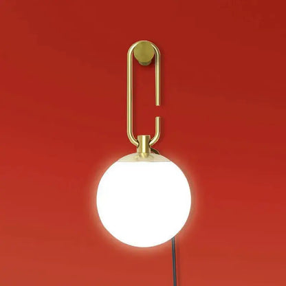Modern black and gold glass ball pendant lights with gold-toned wall-mounted lamp and frosted glass globe decorbites glass ball