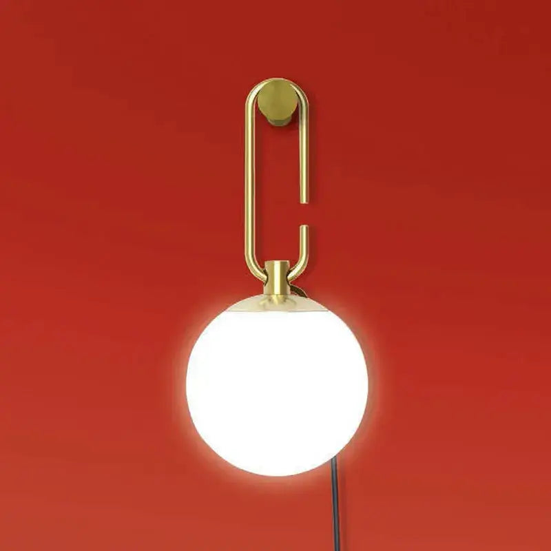 Modern black and gold glass ball pendant lights with gold-toned wall-mounted lamp and frosted glass globe decorbites glass ball