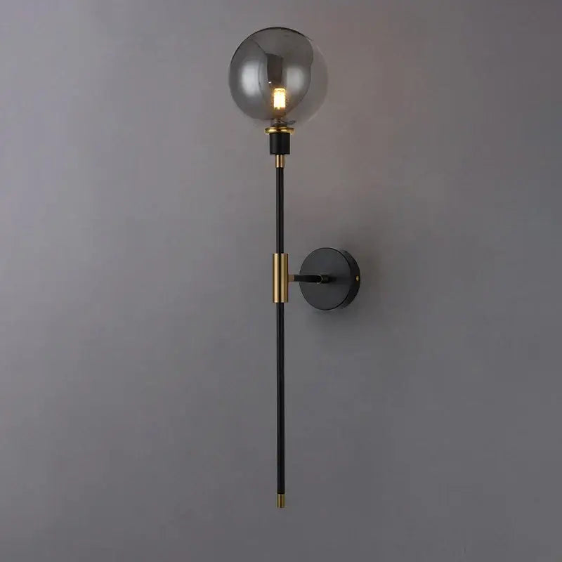 Modern black and gold glass ball wall lamp with a spherical smoked glass shade for stylish living room decorbites wall lamp