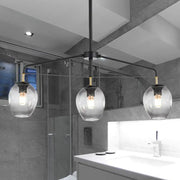 Decorbites modern black metal island lamp with dimpled bubble shade and clear glass globes with gold accents