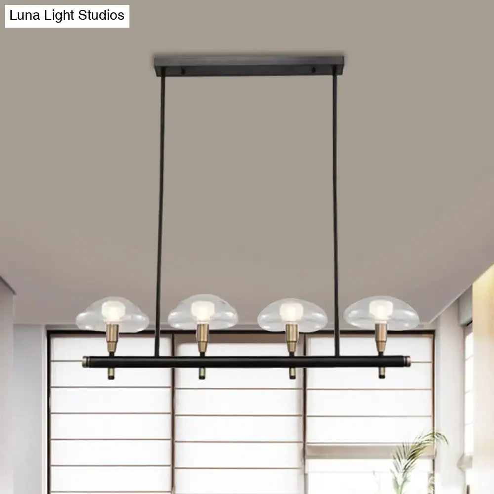 DecorBites black metal pendant light with four cloud-shaped clear glass shades and brass accents for restaurants