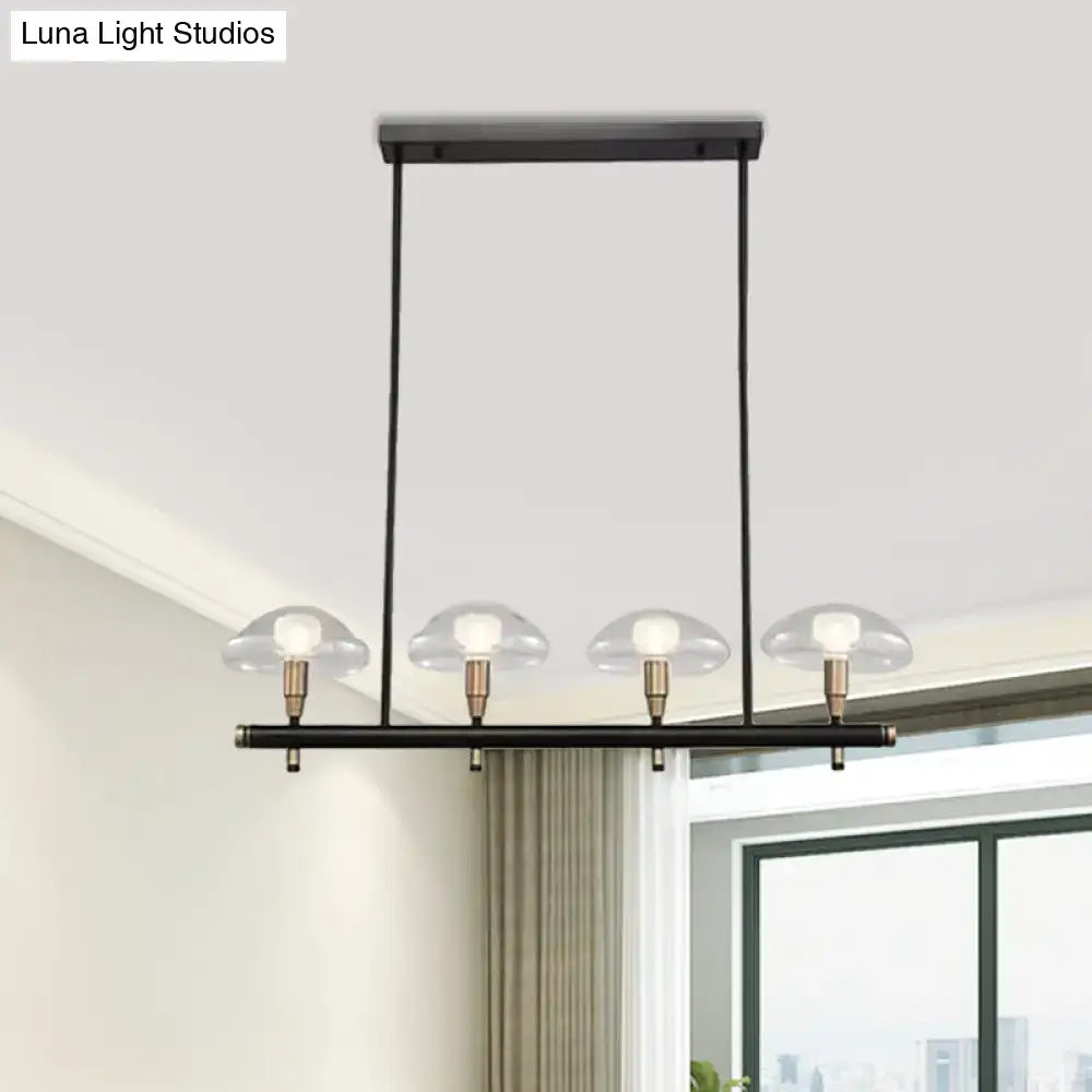 DecorBites™ black metal pendant light with four clear glass shades and brass bulb holders, ideal for restaurants