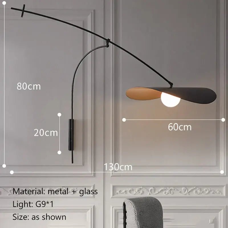Modern black and gold leaf led wall lamp with curved arm and glass shade for bedroom lighting