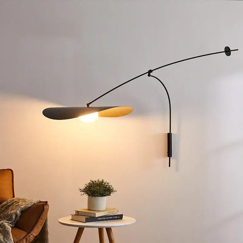 Modern black and gold leaf led wall lamp with glass shade featuring a matte black and warm gold dual-toned design
