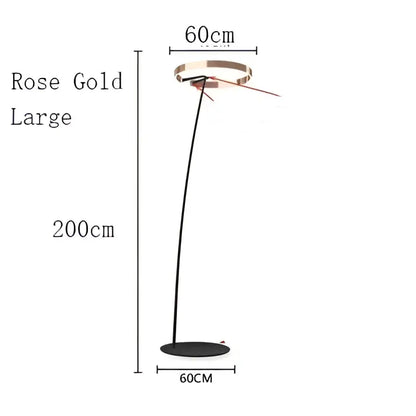 Modern rose gold led floor lamp with sleek curved stem and circular base for living room lighting