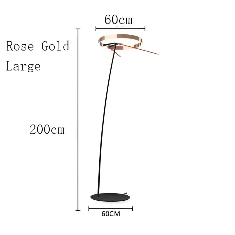 Modern rose gold led floor lamp with sleek curved stem and circular base for living room lighting