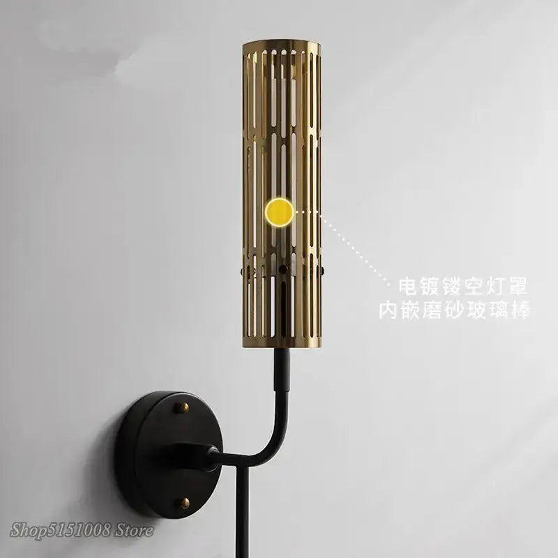 Modern black and gold led wall lamp with gold-toned cylindrical slats and black mounting base for living room decorbites led wall