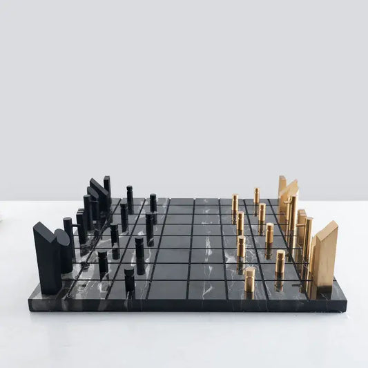 Modern black and gold metal marble chessboard with sleek decorbites golden metal pieces for living room decor