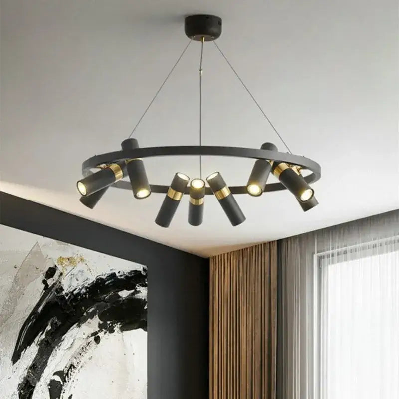 Modern black and gold ring led pendant light featuring a circular black ring led with gold-accented cylindrical lights