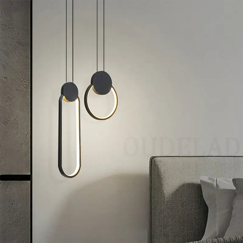 Modern black and gold ring pendant lamp with sleek circular design hanging from thin cords for dining room decorbites black ring pendant