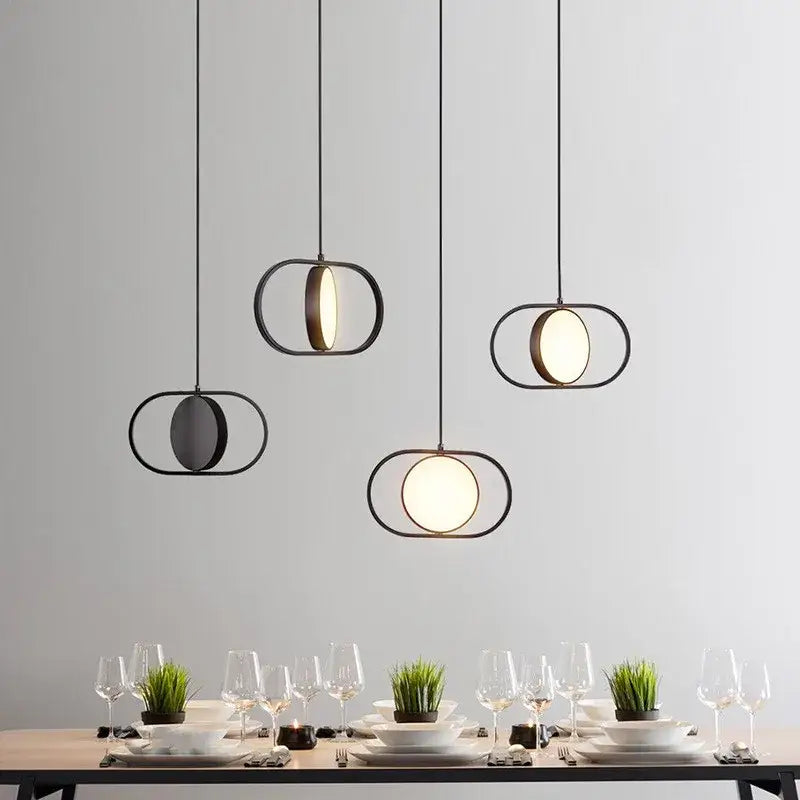 Modern black and gold trumpet pendant light with circular illuminated glass panels for dining room decorbites gold trumpet