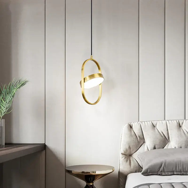 Modern black and gold trumpet pendant light with a gold-toned oval design hanging from a black cord for dining room decorbites gold trumpet pendant