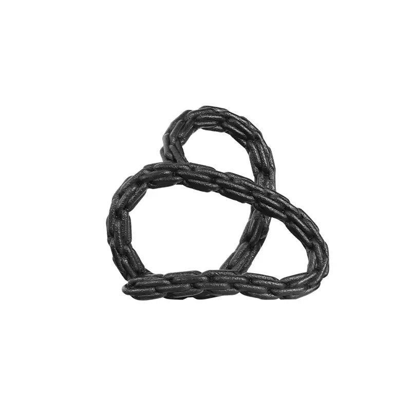 Modern black and golden knot chain sculpture featuring a black braided leather knot chain ring with a twisted design