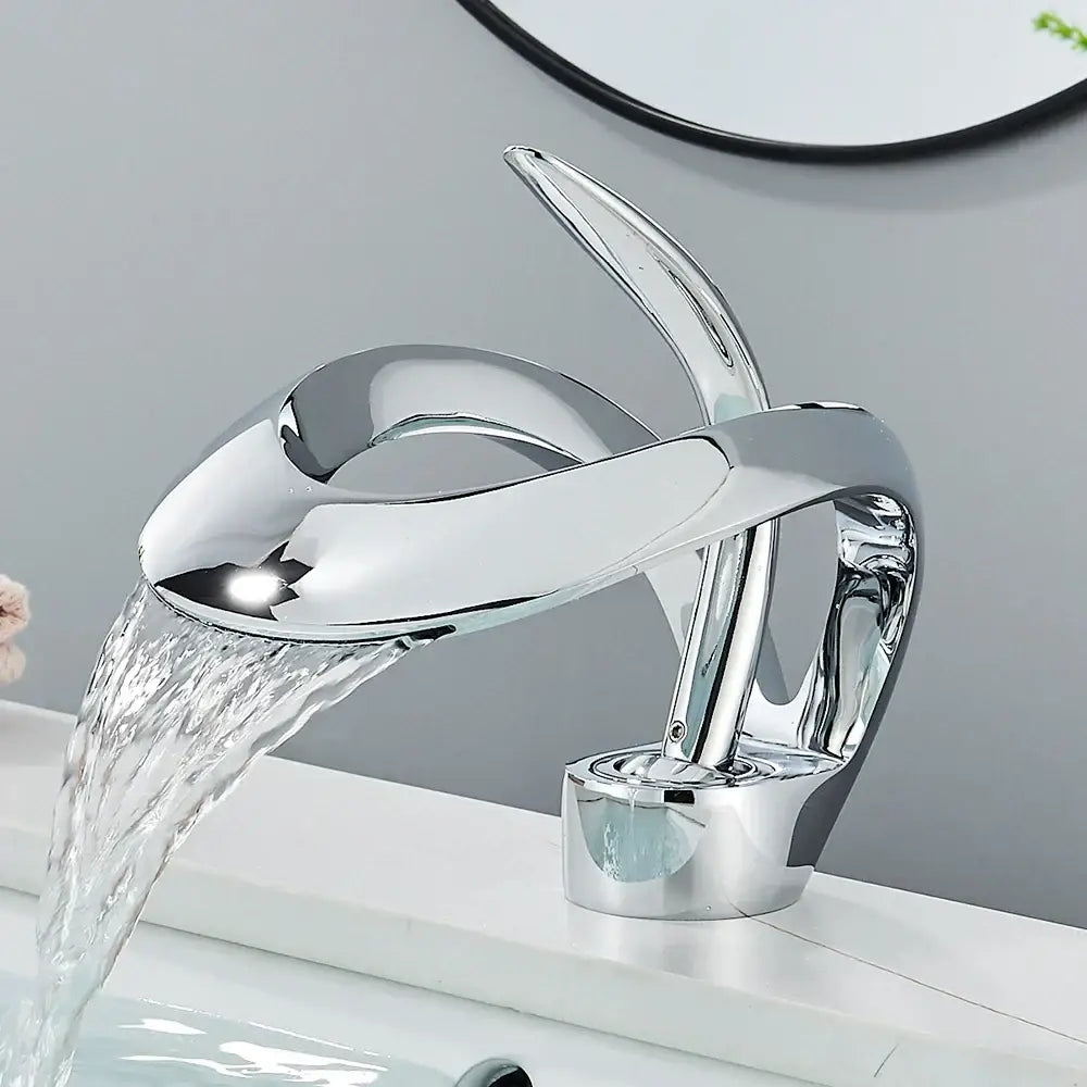 Modern black and grey waterfall mixer tap with chrome finished sculptural basin faucet and sleek modern design