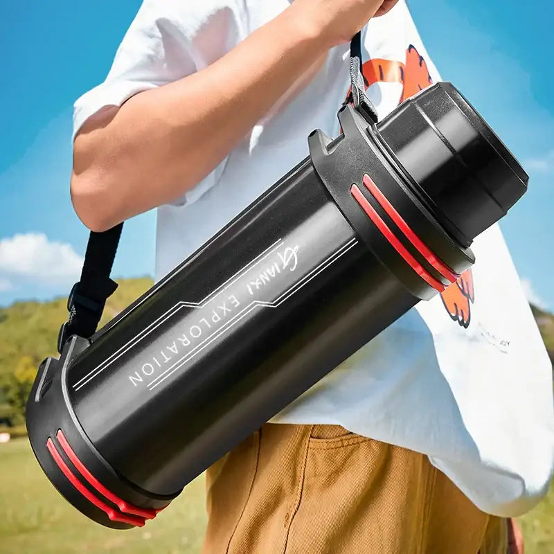 Modern black and red stainless steel thermos bottle with gymini exploration branding designed as a travel kettle