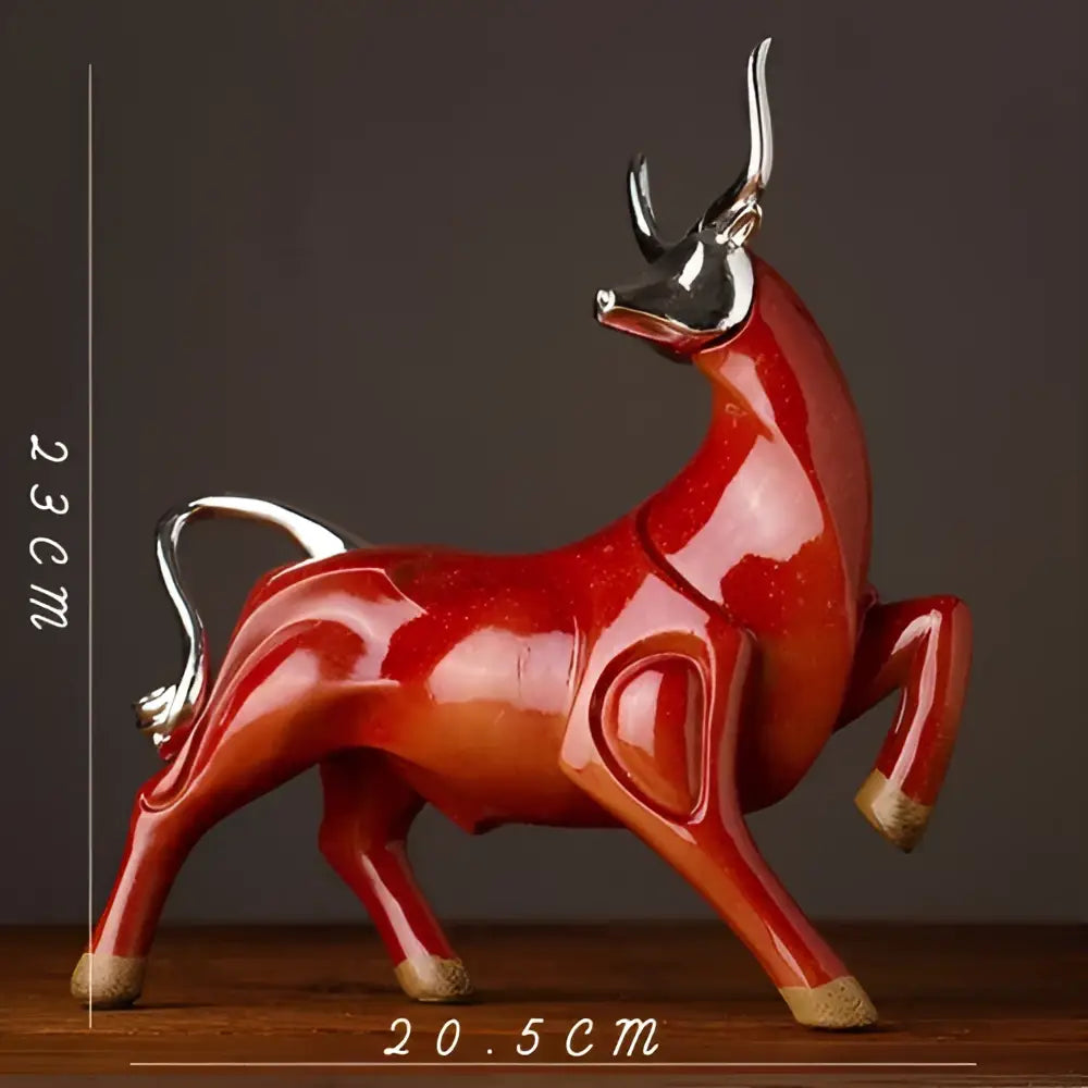 Glossy red ceramic decorbites bull sculpture with silver horns and hooves for modern living room decor
