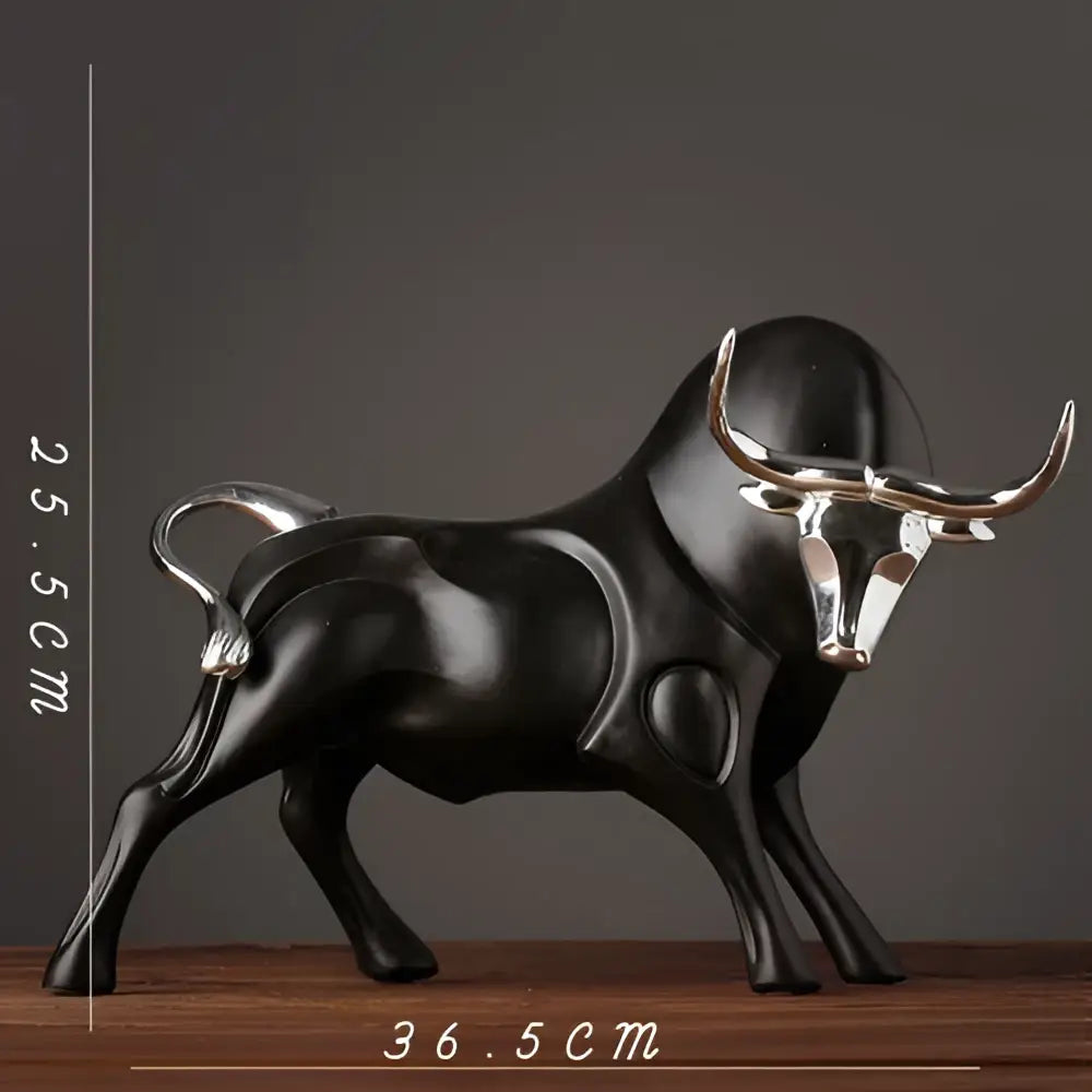 Modern black and silver decorbites bull sculpture with polished metallic horns and tail for living room decor