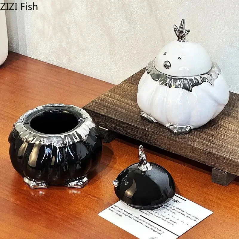 Modern black and silver duck shaped ceramic ashtray with white ceramic chick jar and silver metallic accents decorbites duck shaped decor