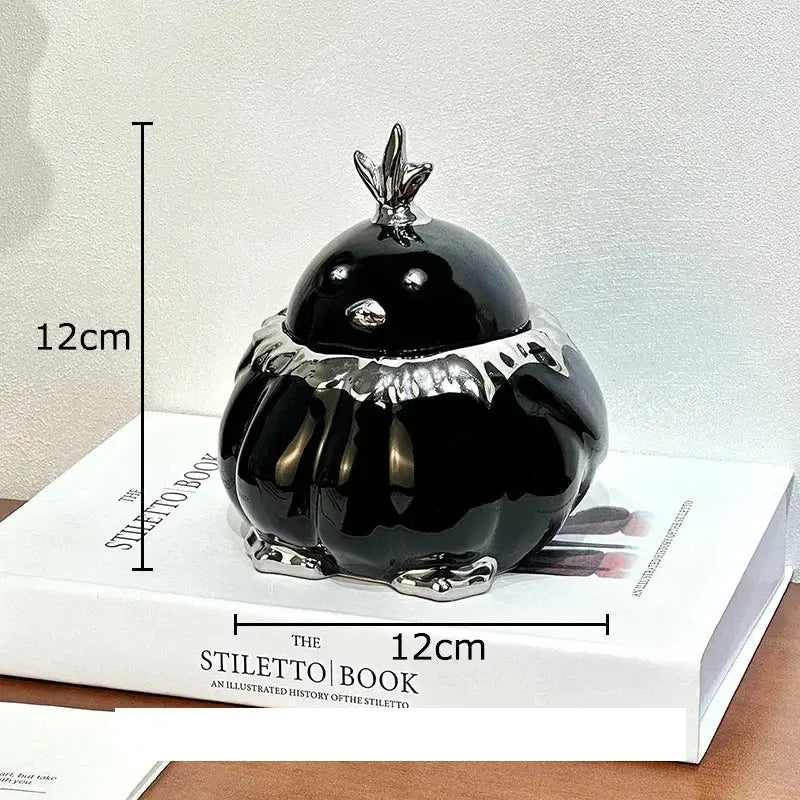 Modern black and silver duck shaped ceramic ashtray with silver metallic accents for decorbites duck shaped living room decor