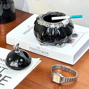 Modern black and silver duck shaped ceramic ashtray with glossy pumpkin shape and metallic rim for living room decorbites duck shaped