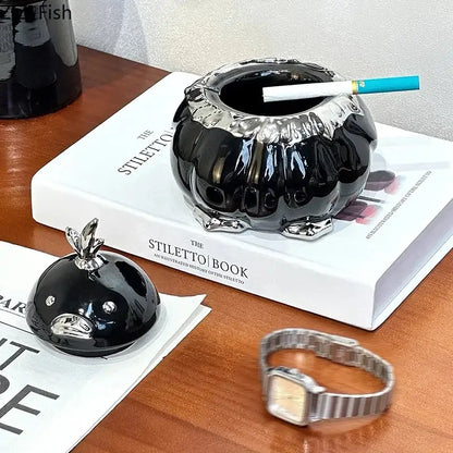 Modern black and silver duck shaped ceramic ashtray with glossy pumpkin shape and metallic rim for living room decorbites duck shaped