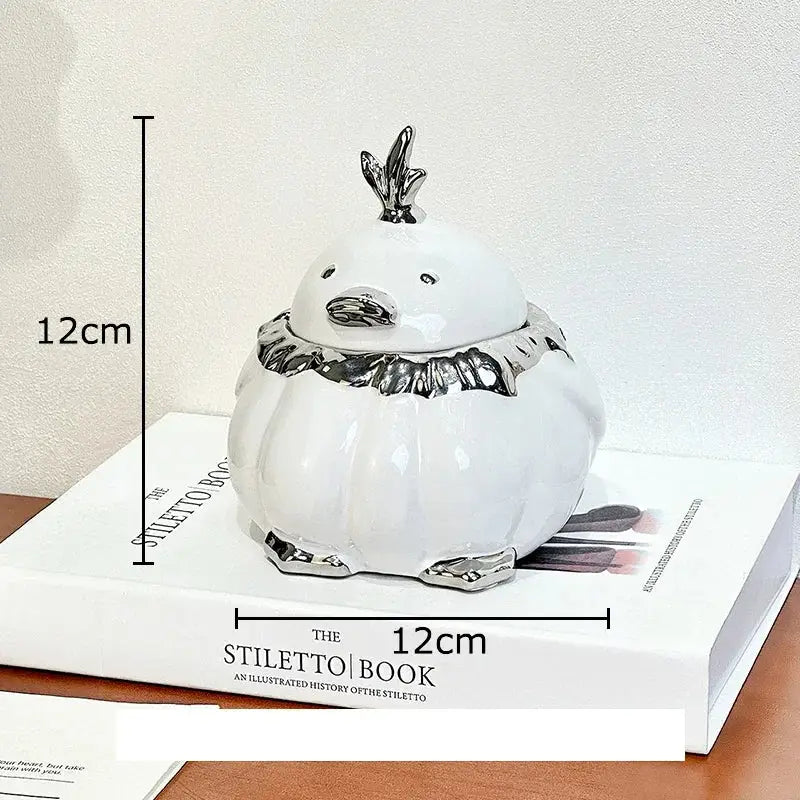 Modern black and silver decorbites duck shaped ceramic ashtray with white ceramic body and silver metallic accents for living room decor