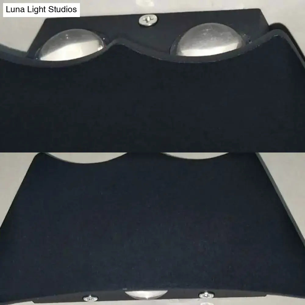 Modern black and silver led wall sconce bedroom light 110v-120v with fabric cover and two circular silver reflectors viewed from back
