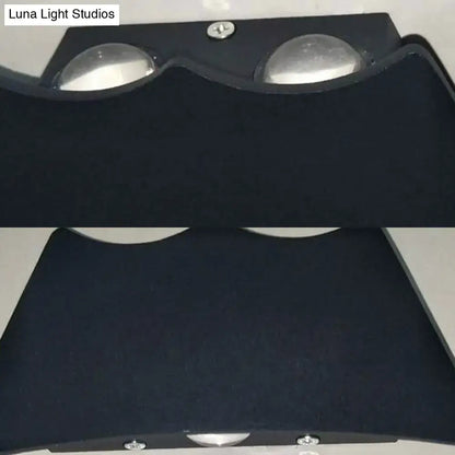 Modern black and silver led wall sconce bedroom light 110v-120v with fabric cover and two circular silver reflectors viewed from back