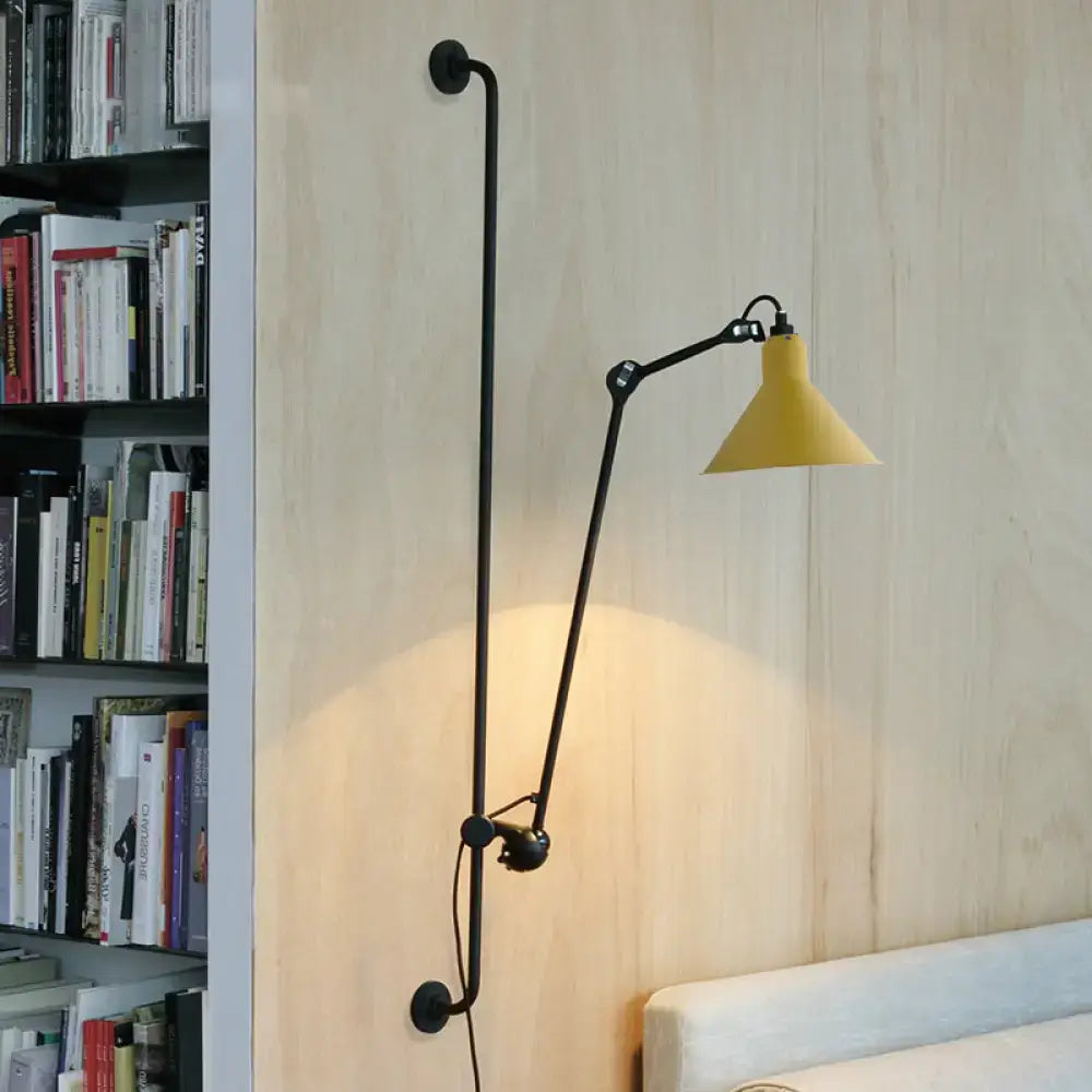 Yellow conical shade wall lamp with black articulated arm direct wired electric for modern bedroom lighting