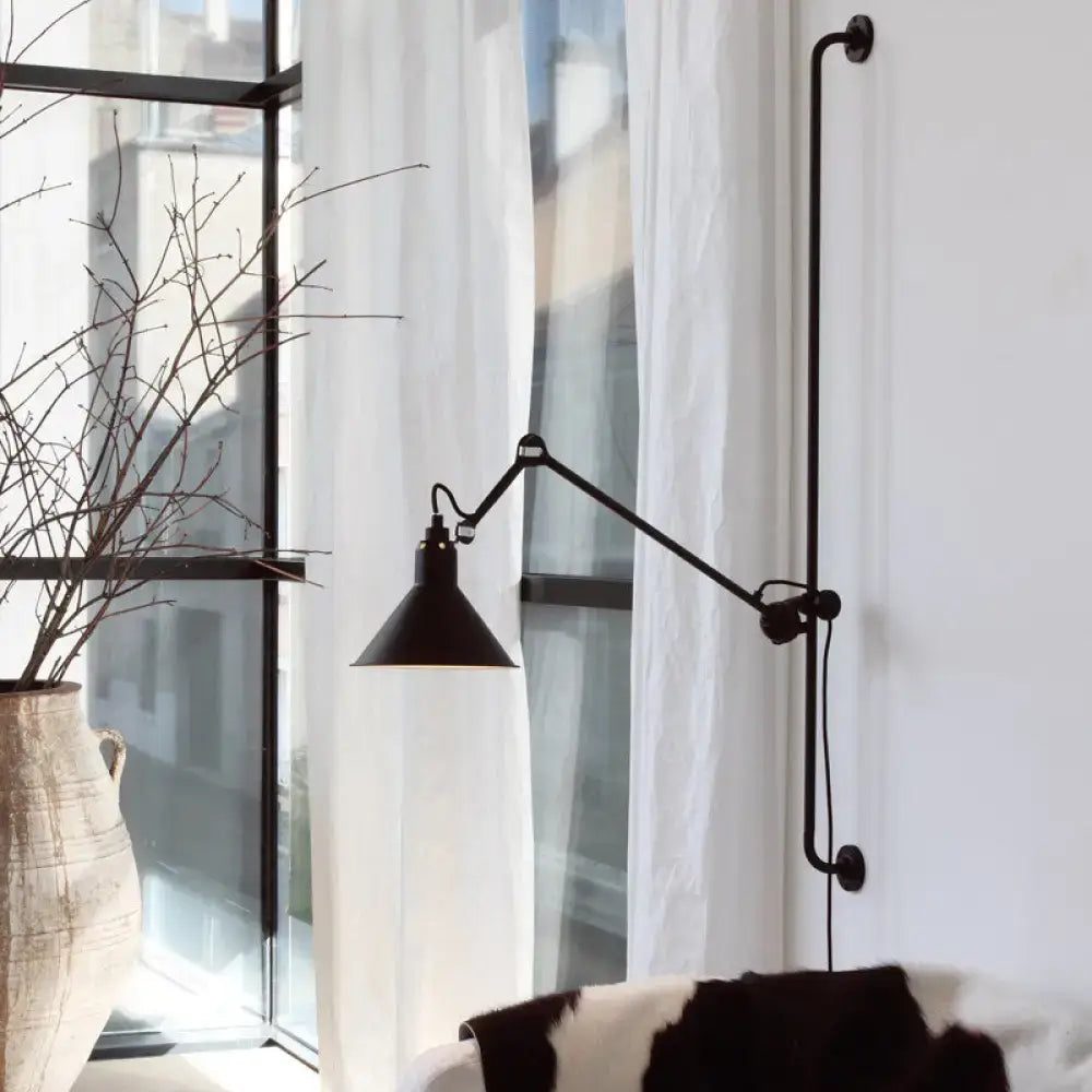 Black industrial-style direct wired electric wall lamp with articulated arm and conical shade for bedroom use